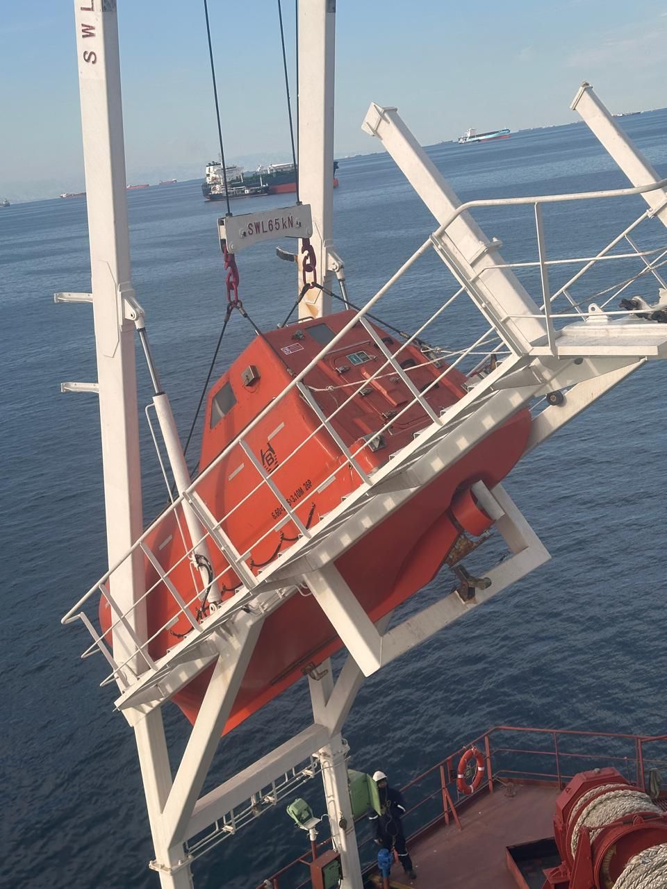 Service provider carrying out lifeboat maintenance